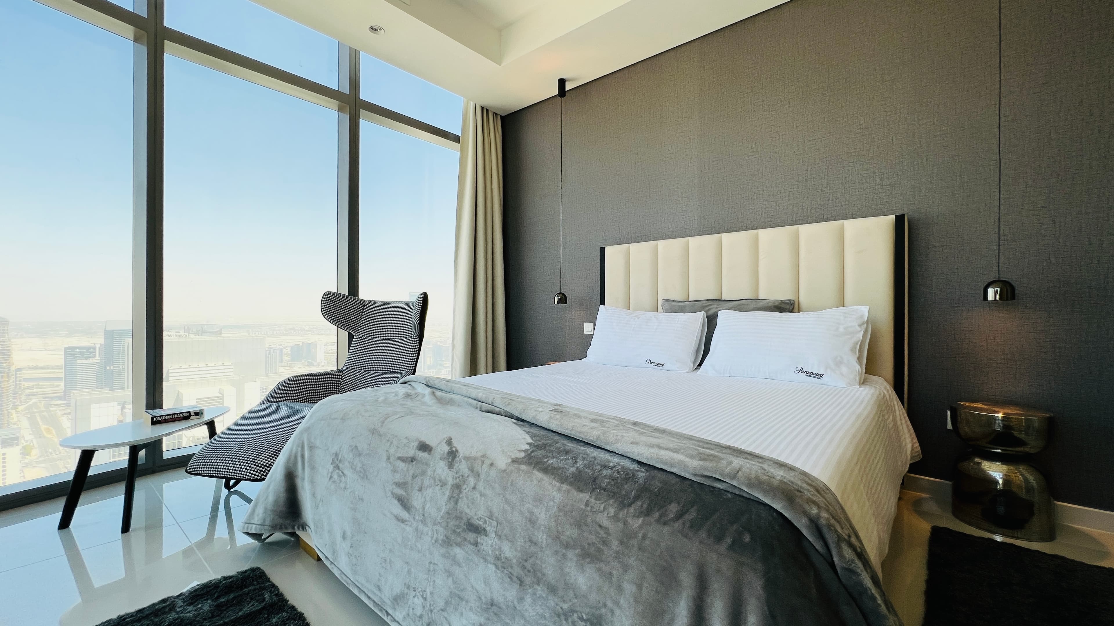 Master bedroom with Paramount linens and city views